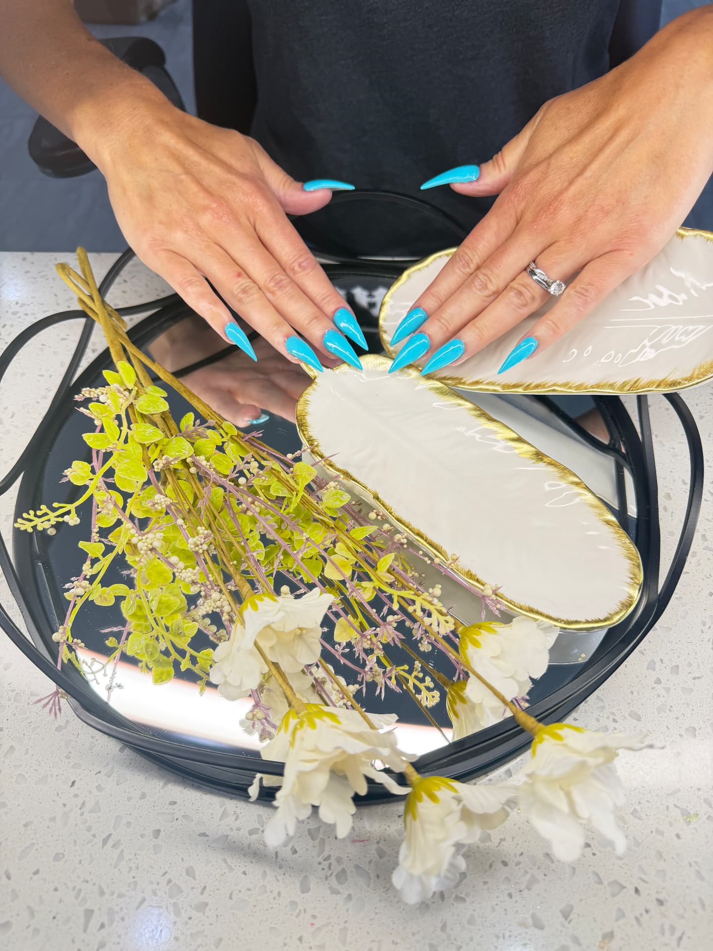 Bright blue stiletto manicure