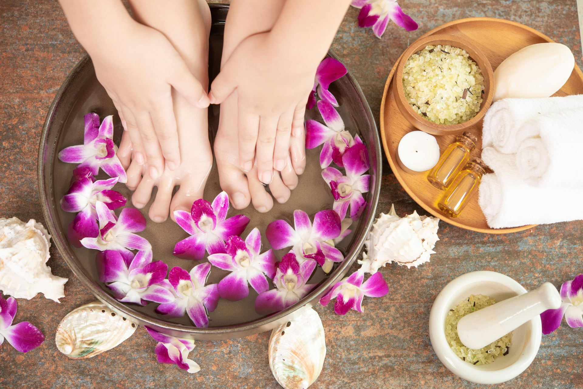 Deluxe pedicure soak with orchids, sea salt, oils, and warm towels
